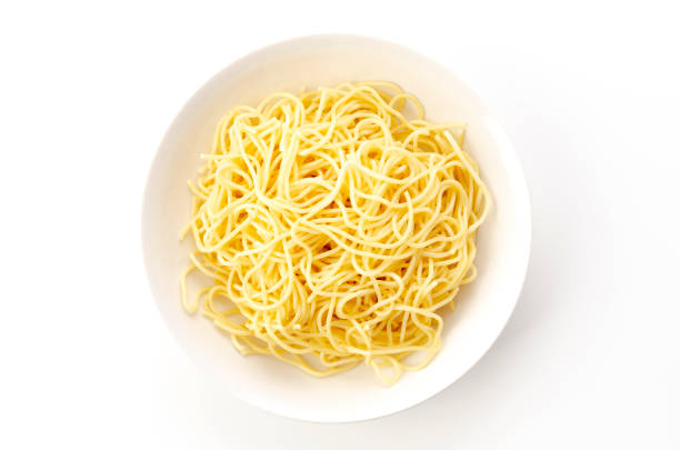 istock Spaghetti Noodles in Plate on White Background 1321792186