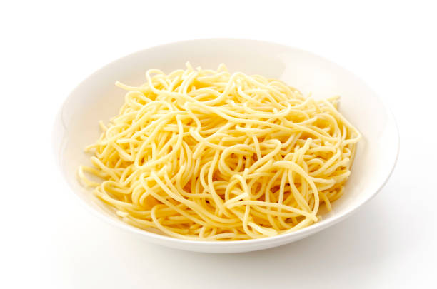 istock Spaghetti Noodles in Plate on White Background 1321792904