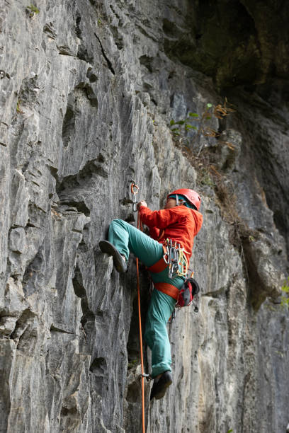 istock Woman rock climber climbing on the cliff 1321793039