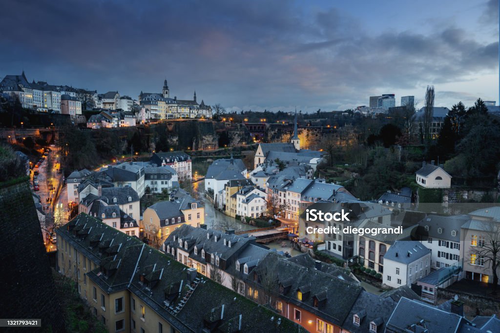 Luxembourg city skyline at night - Aerial view of The Grund with St Michaels Church on background - Luxembourg City, Luxembourg Luxembourg City - Luxembourg Stock Photo