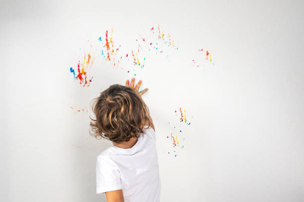 istock Boy Showing Colorful Paint on His Hands 1321795360