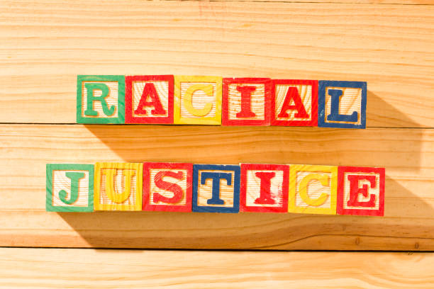Spectacular wooden cubes with the word RACIAL JUSTICE on a wooden surface. Spectacular wooden cubes with the word RACIAL JUSTICE on a wooden surface. george floyd protests stock pictures, royalty-free photos & images