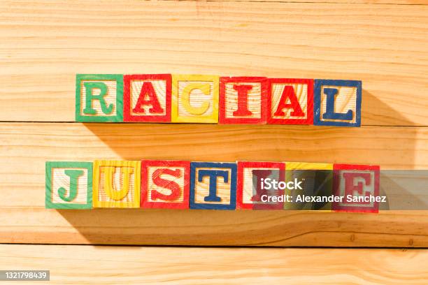 Spectacular Wooden Cubes With The Word Racial Justice On A Wooden Surface Stock Photo - Download Image Now