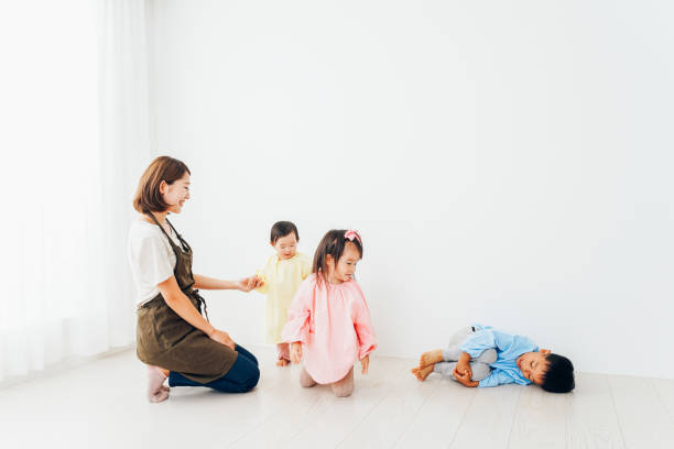 istock Children playing at the kindergarten with nursery teachers 1321799107