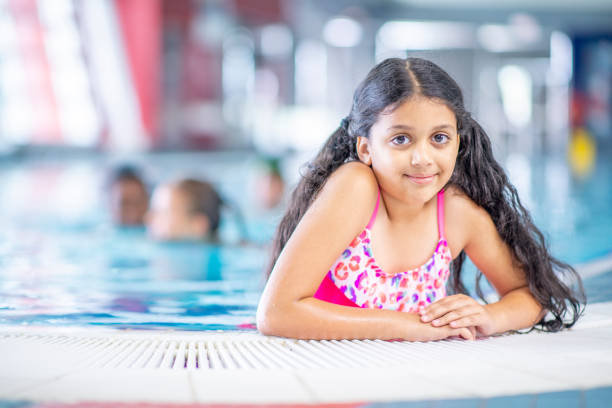 istock Friends at the pool 1321814771