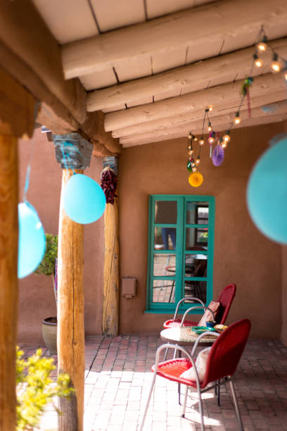Party Decorations on Porch: String Lights and Balloons