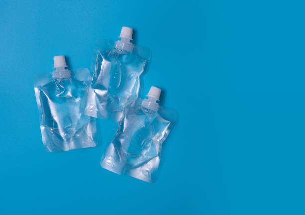 istock Transparent  plastic package for water or gel on a blue background 1321839120