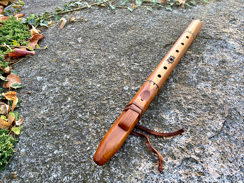 High angle closeup photo of a traditional Native American wooden flute handmade in New Mexico