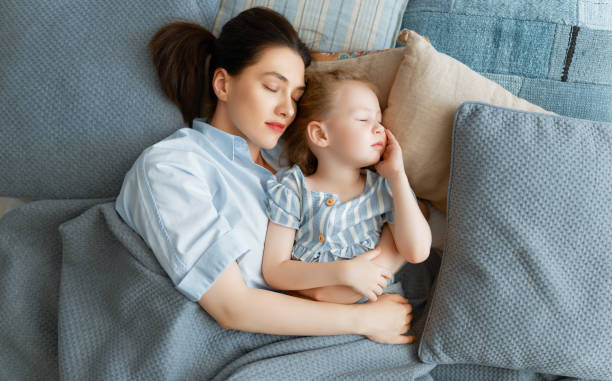 istock girl and her mother are napping 1321842142
