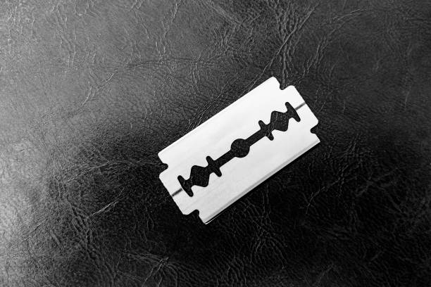 stainless steel blade isolated on textured background