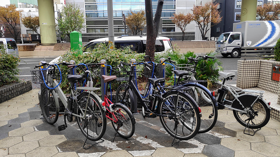 Osaka, Japan- 02 Dec, 2019: Many bicycles parked on footpath in namba street, Osaka. The Japanese city is popular to cycle as transportation mode