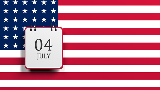 Red-colored small calendar with the date of four of July. On the American flag. Horizontal composition with copy space