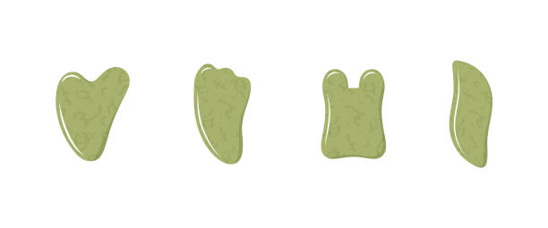 istock Gua sha scraper for facial massage. Collection of different shape natural green nephrite stones. Skin care, home beauty procedures and morning routine. Vector illustration in flat cartoon style 1321851269