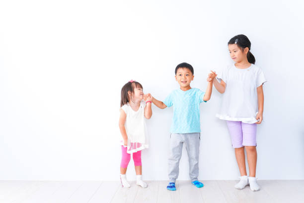 istock Children playing together with smiles 1321852515