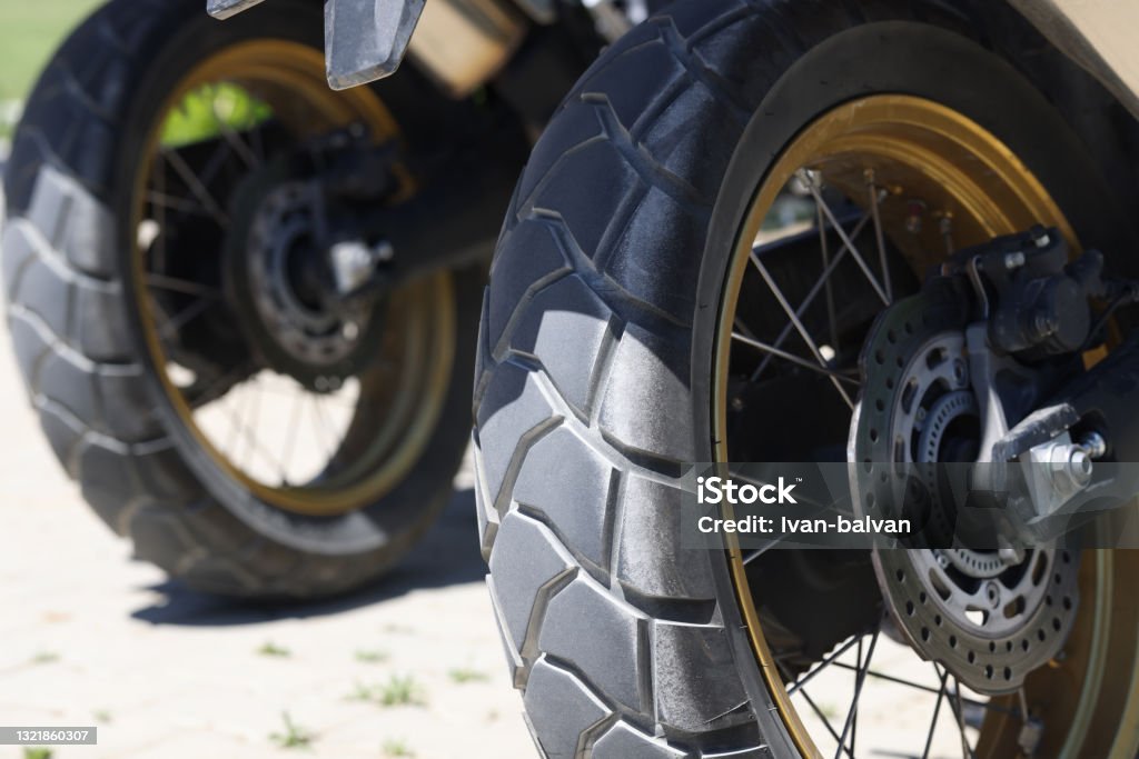 Two rear wheels of a motorcycle with brake discs closeup Two rear wheels of a motorcycle with brake discs. main criteria for choosing the right tires for a motorbike Aluminum Stock Photo
