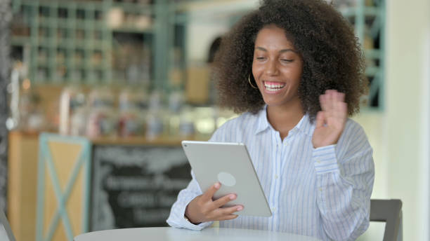 istock Serious Professional Young African Woman using Tablet in Cafe 1321863815