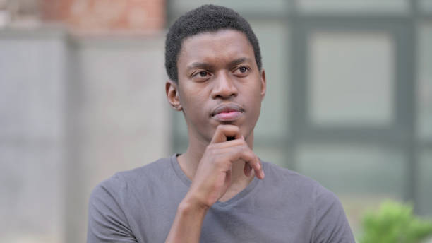 istock Portrait of Thoughtful Young  African Man Thinking 1321863898