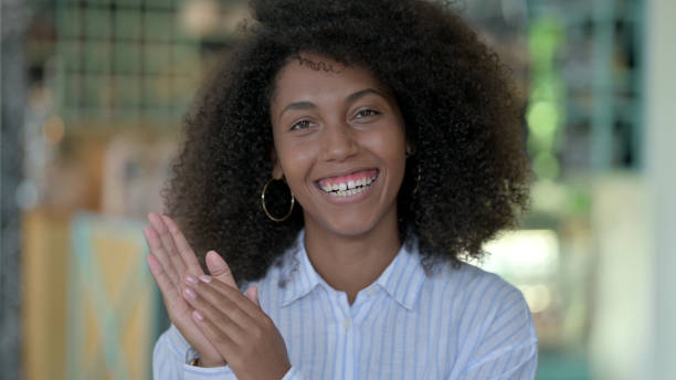 istock Excited African Woman Clapping 1321864082