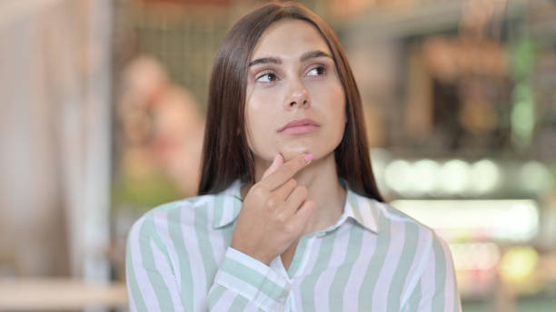 istock Pensive Young Latin Woman Thinking about Something 1321864960