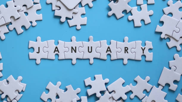 istock JANUARY word written on white jigsaw puzzle 1321864971