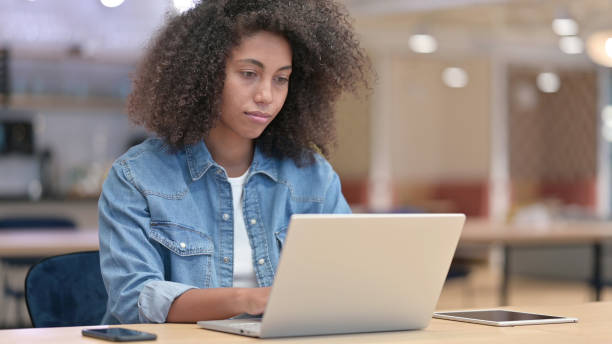 istock African Woman Working on Laptop at Work 1321866573