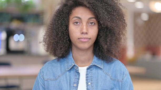 istock Serious African Woman Looking at Camera 1321866865