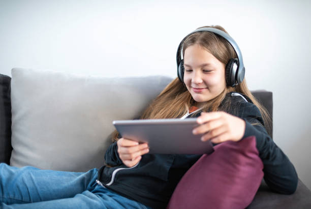 istock A girl watching TV at home 1321868704