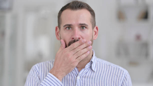 istock Portrait of Upset Young Man feeling Shocked 1321868876