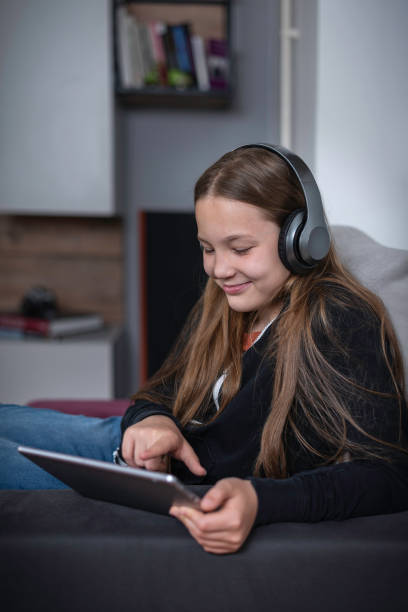 istock A girl watching TV at home 1321869043