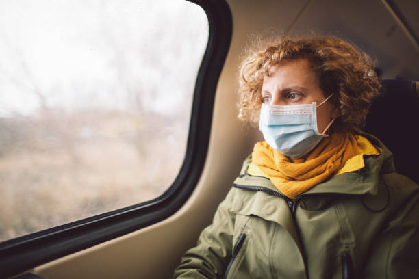 portrait de femme en train - vehicle interior indoors window chair photos et images de collection