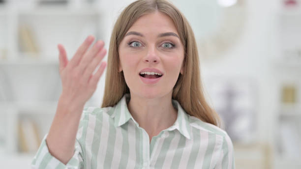 istock Portrait of Assertive Young Woman Inviting Gesture 1321872204