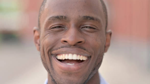 istock Close Up of Smiling African Man 1321873209