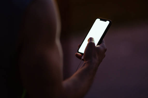 istock Unrecognizable Athlete Using Mobile Phone After Outdoor Workout 1321876957