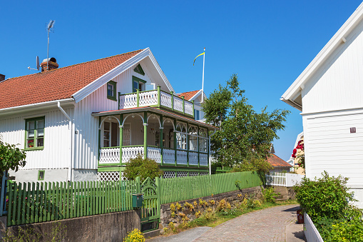 Fiskebäckskil, Sweden - July 09, 2015: Old wooden houses on a street
