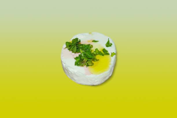 istock tomino cheese with olive oil and parsley 1321878134