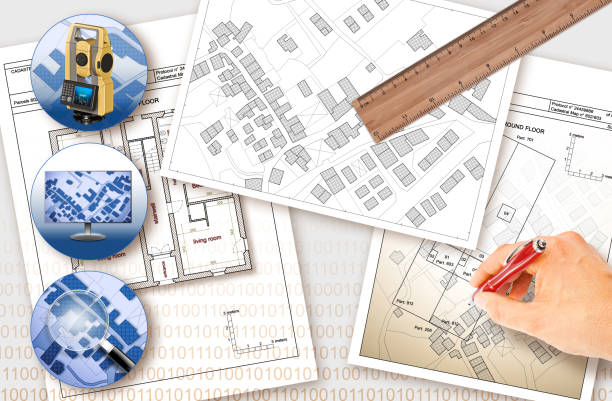 istock Updating public cadastral digital databases and information about land registry - concept image with an imaginary cadastral map of territory with buildings, roads and land parcel - Note: The map background is totally invented and does not represent any re 1321879704