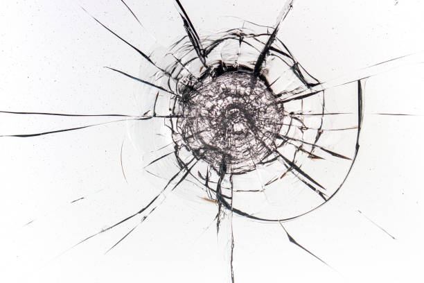 istock Cracks on the glass on a white background. 1321879908
