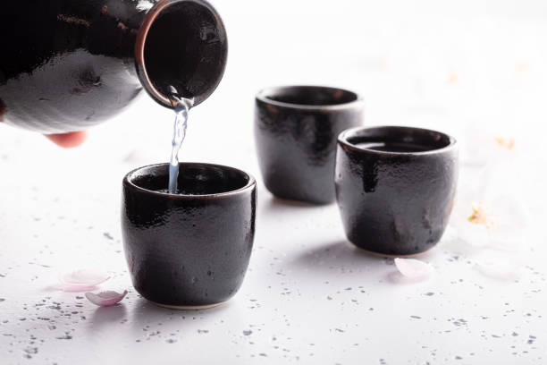 istock Japanese sake with blooming cherry. Traditionally served sake in ceramics. 1321882524