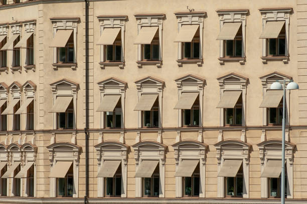 stockholm sweden july 6 \n - 2005 from stockholm \n -  brown house facade with brown awnings