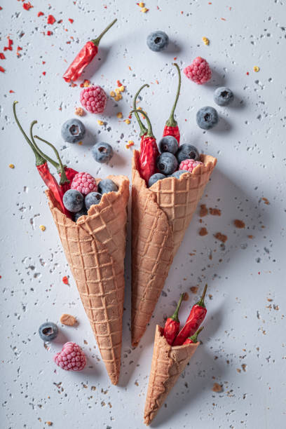 istock Cold ice cream with berries and chilli. Strange icecream. 1321882733
