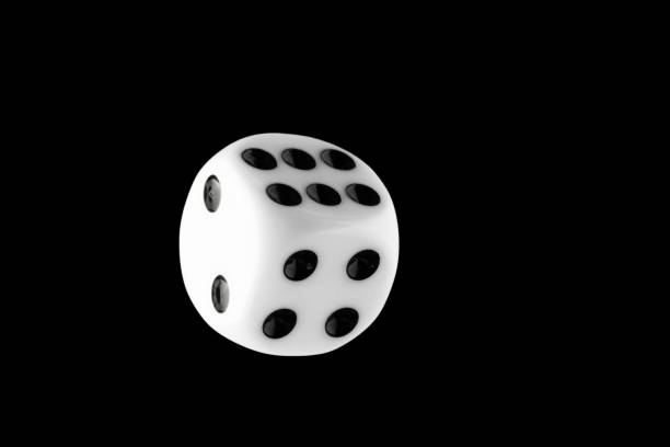 istock the dice are black with white dots, isolated on a black background for clipping 1321885161
