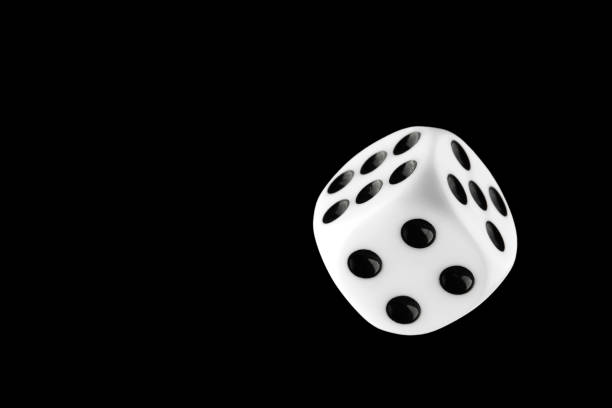 istock the dice are black with white dots, isolated on a black background for clipping 1321885164
