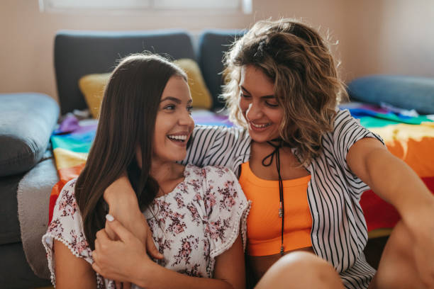 istock Happy lesbian couple at home 1321893500