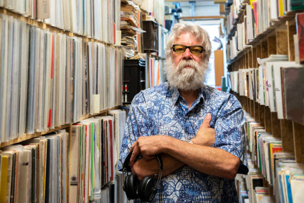 istock Record collector in front of his collection 1321895240