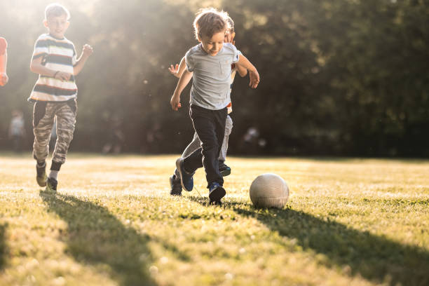 istock Boys playing soccer outdoors 1321899926