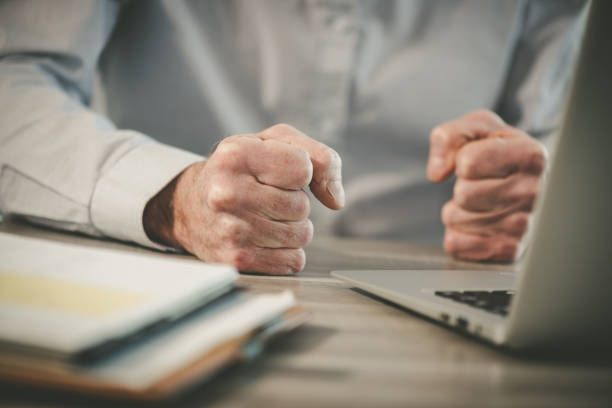 istock Enraged businessman in office 1321902731