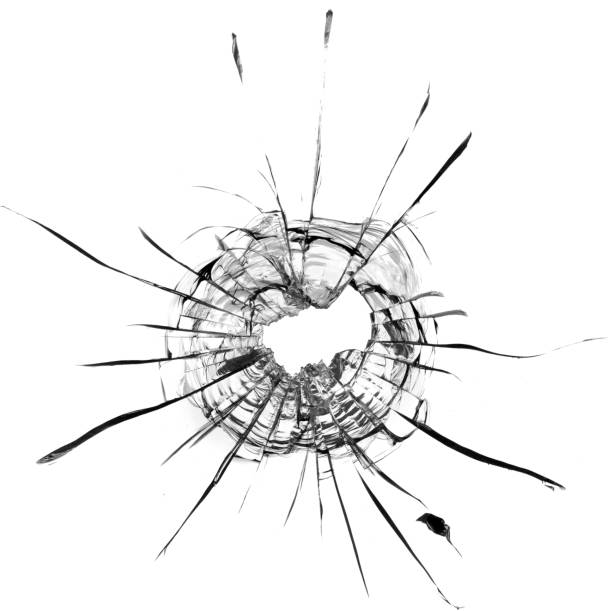 istock Bullet hole in the glass. Isolated on a white background. 1321902821