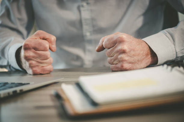 istock Enraged businessman in office 1321903461