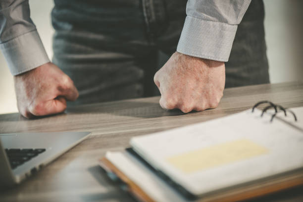 istock Enraged businessman in office 1321903484