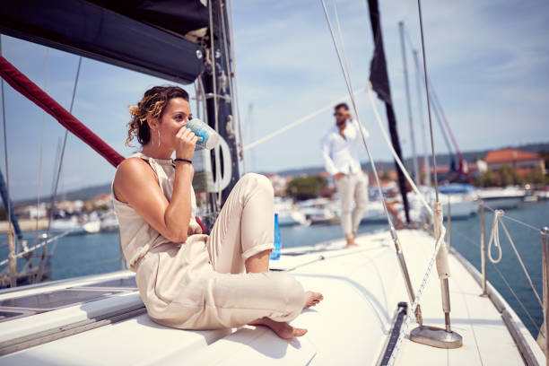 istock Classy rich couple sailing together 1321904213